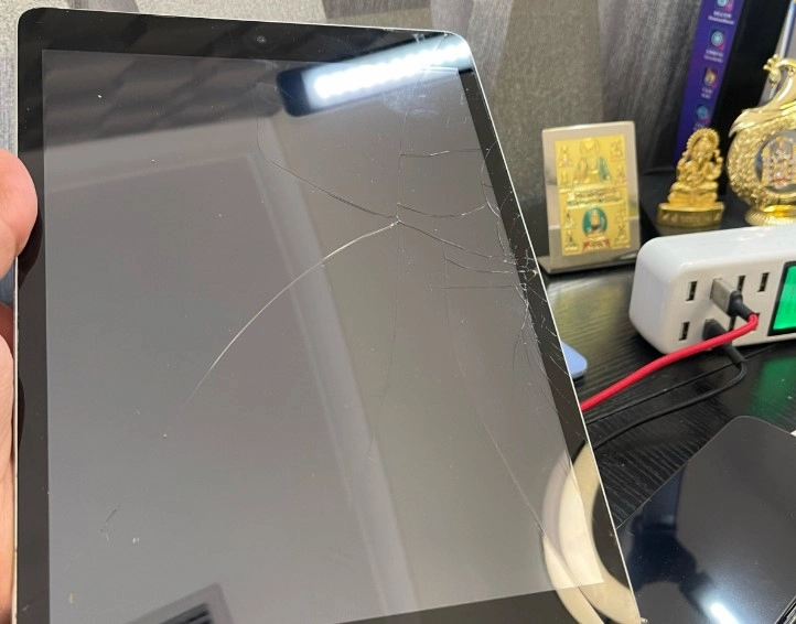 A Broken iPad with cracks.
